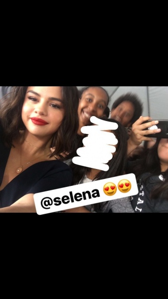 April 19: Selena with a fan at WE Day California in Inglewood, CA (credit: __.jasmine.16)
