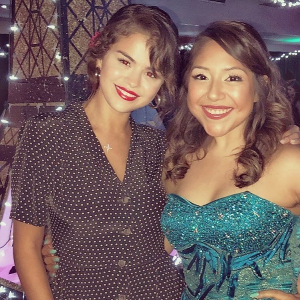 June 23: Selena with a fan at CHOC Children’s Hospital prom in Orange County, CA.


