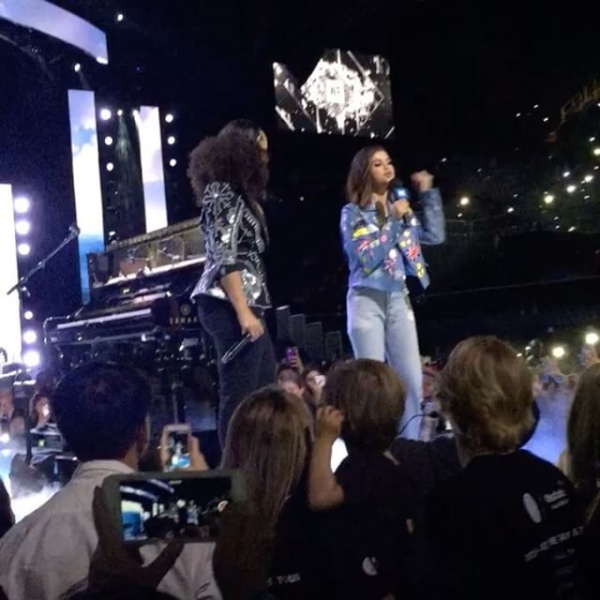 April 27: Fan taken photo of Selena onstage with Alicia Keys at We Day California in Inglewood, California
